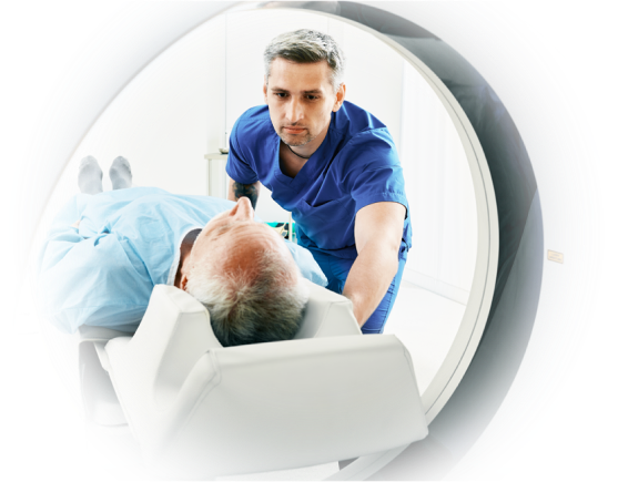 doctor attending to patient in a scanner